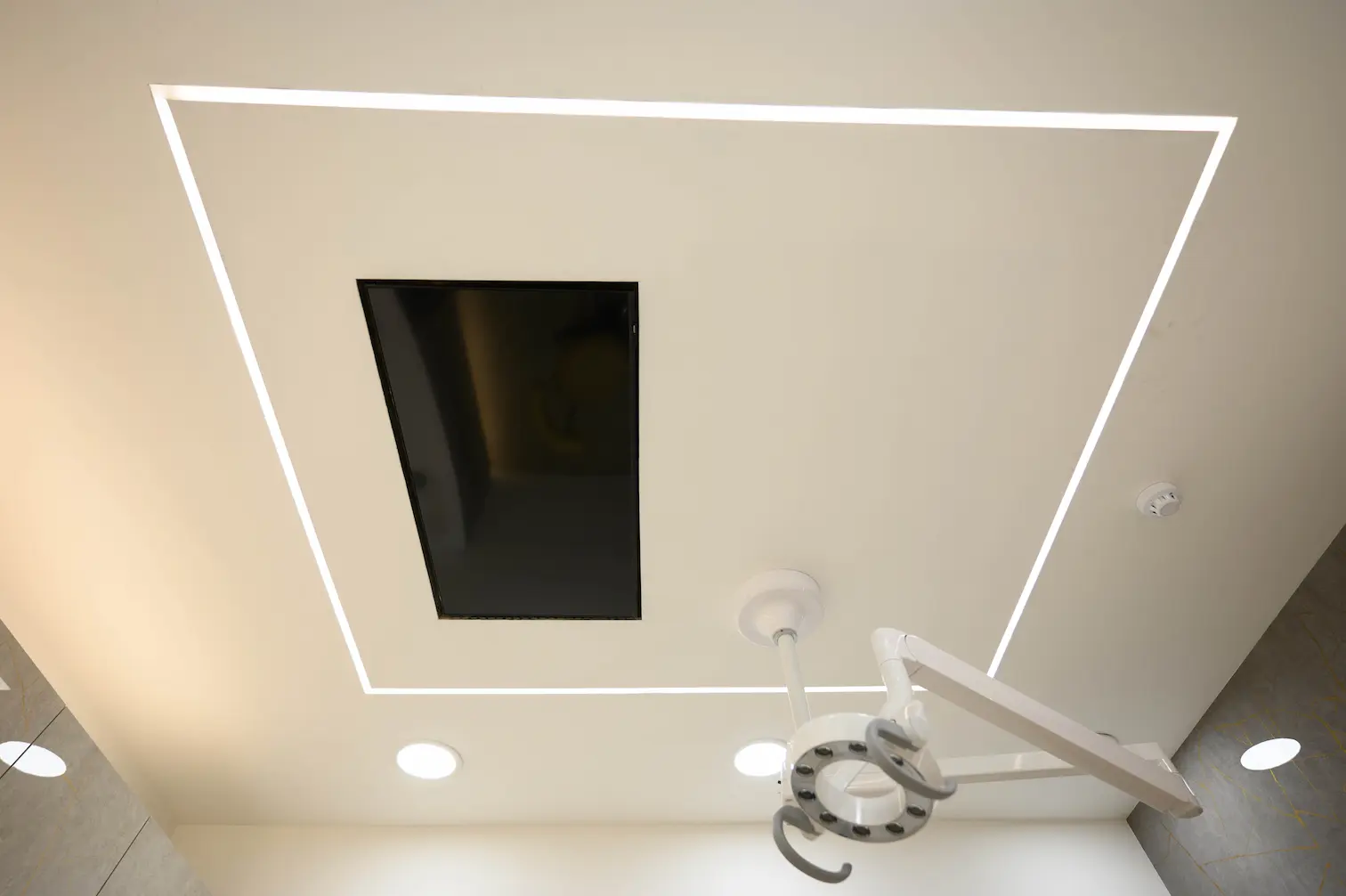 a TV on the ceiling in Clear Smiles Dental practice