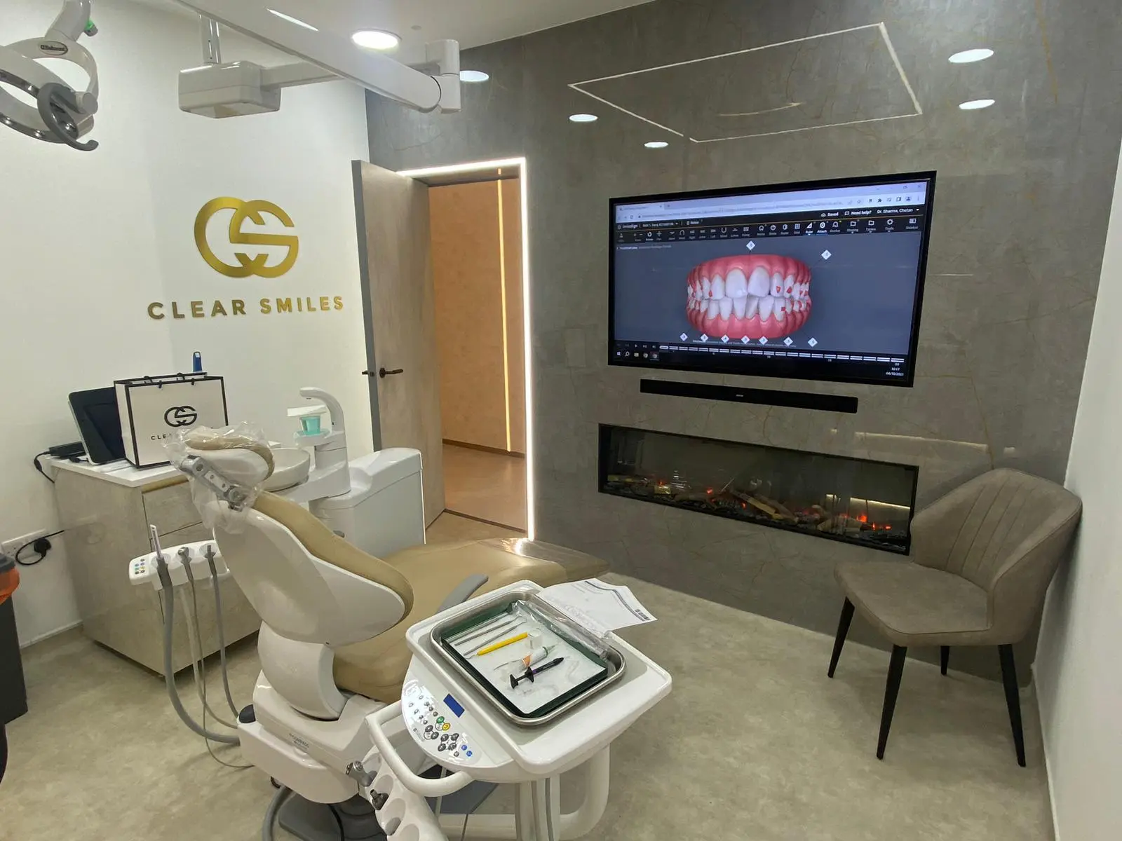 A luxury dental surgery showing an Invisalign plan on a TV